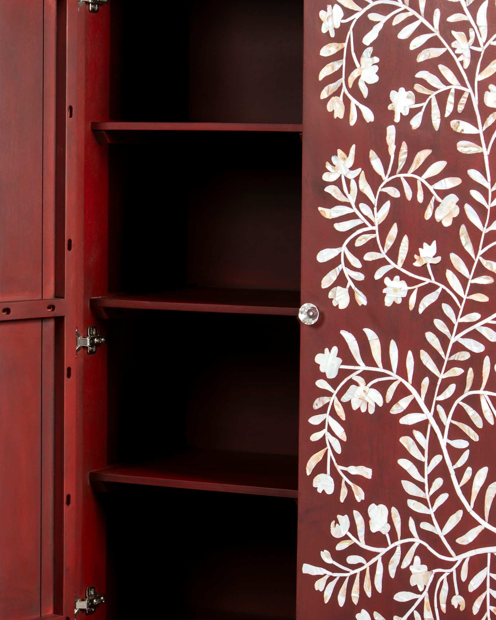Mother of pearl inlay cabinet featuring intricate floral vine pattern in burgundy and white, handcrafted furniture piece.