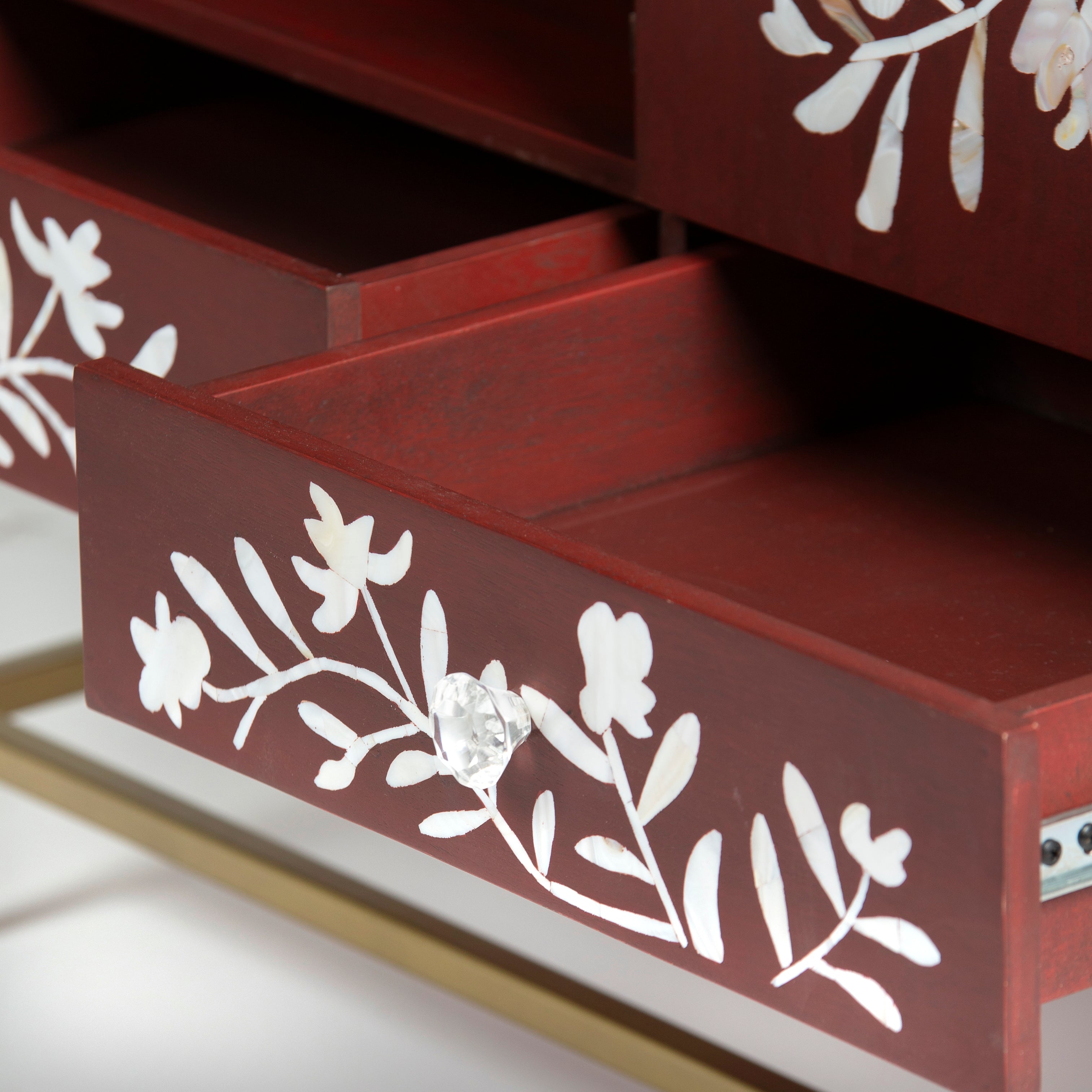 Mother of pearl inlay cabinet featuring intricate floral vine pattern in burgundy and white, handcrafted furniture piece