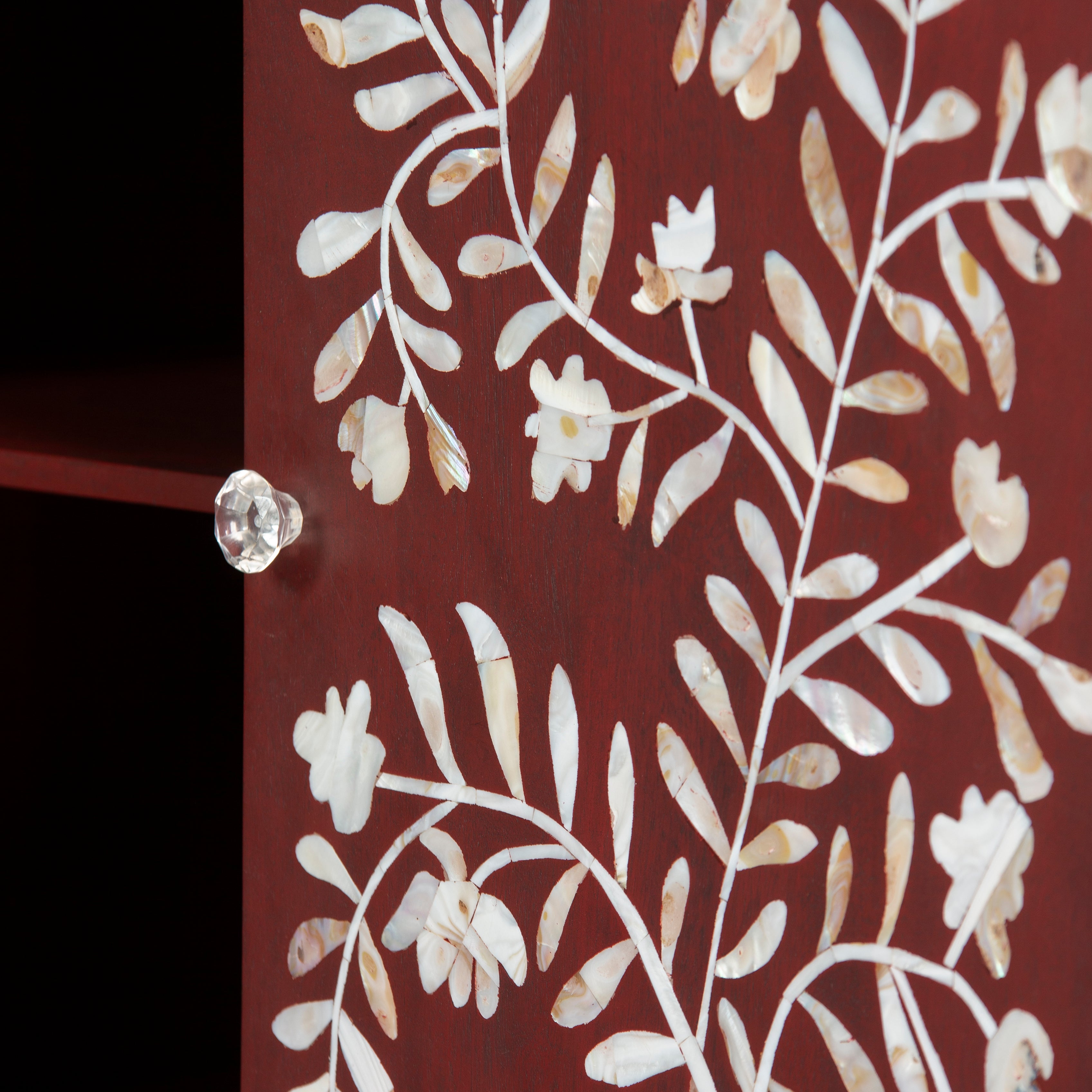 Mother of pearl inlay cabinet featuring intricate floral vine pattern in burgundy and white, handcrafted furniture piece