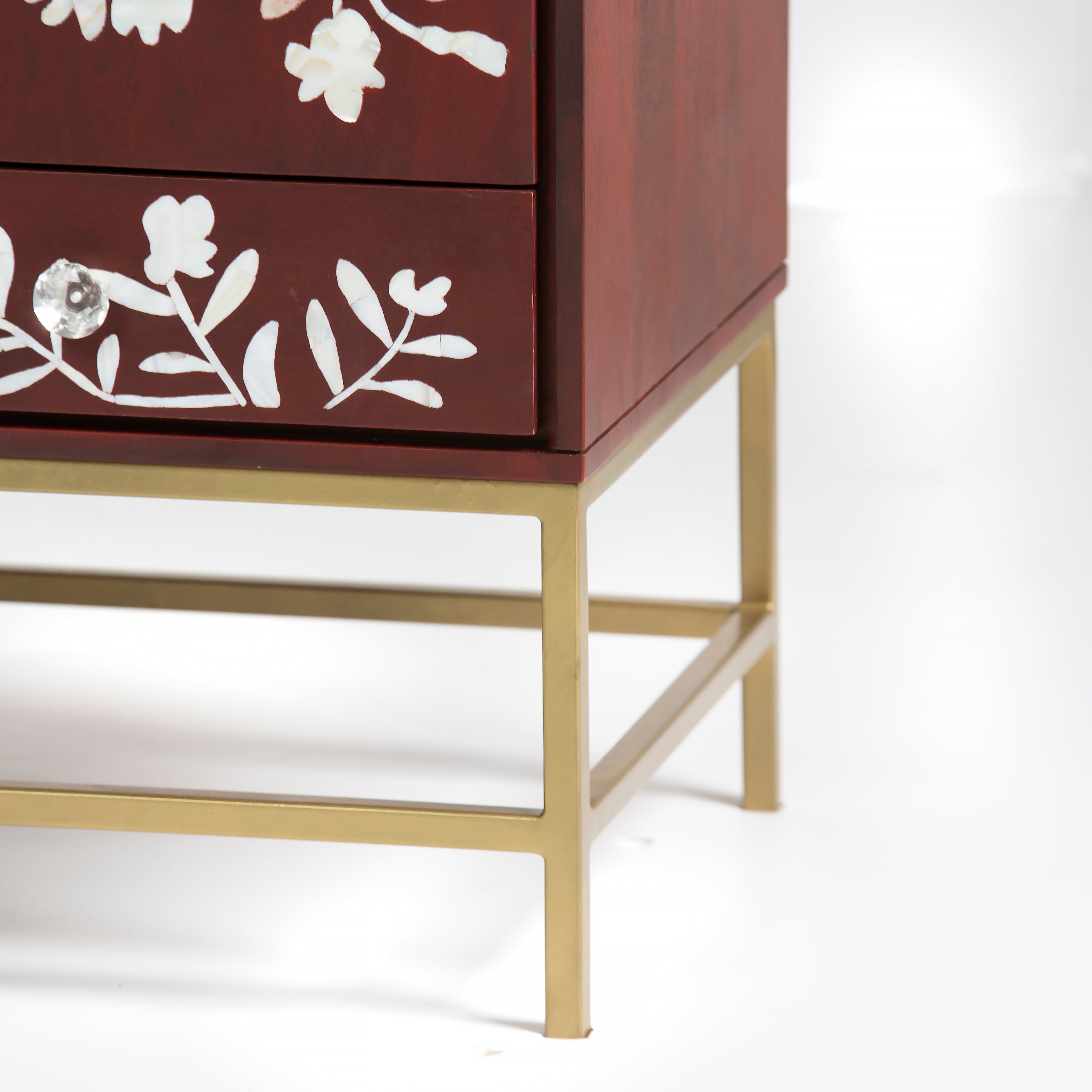 Mother of pearl inlay cabinet featuring intricate floral vine pattern in burgundy and white, handcrafted furniture piece