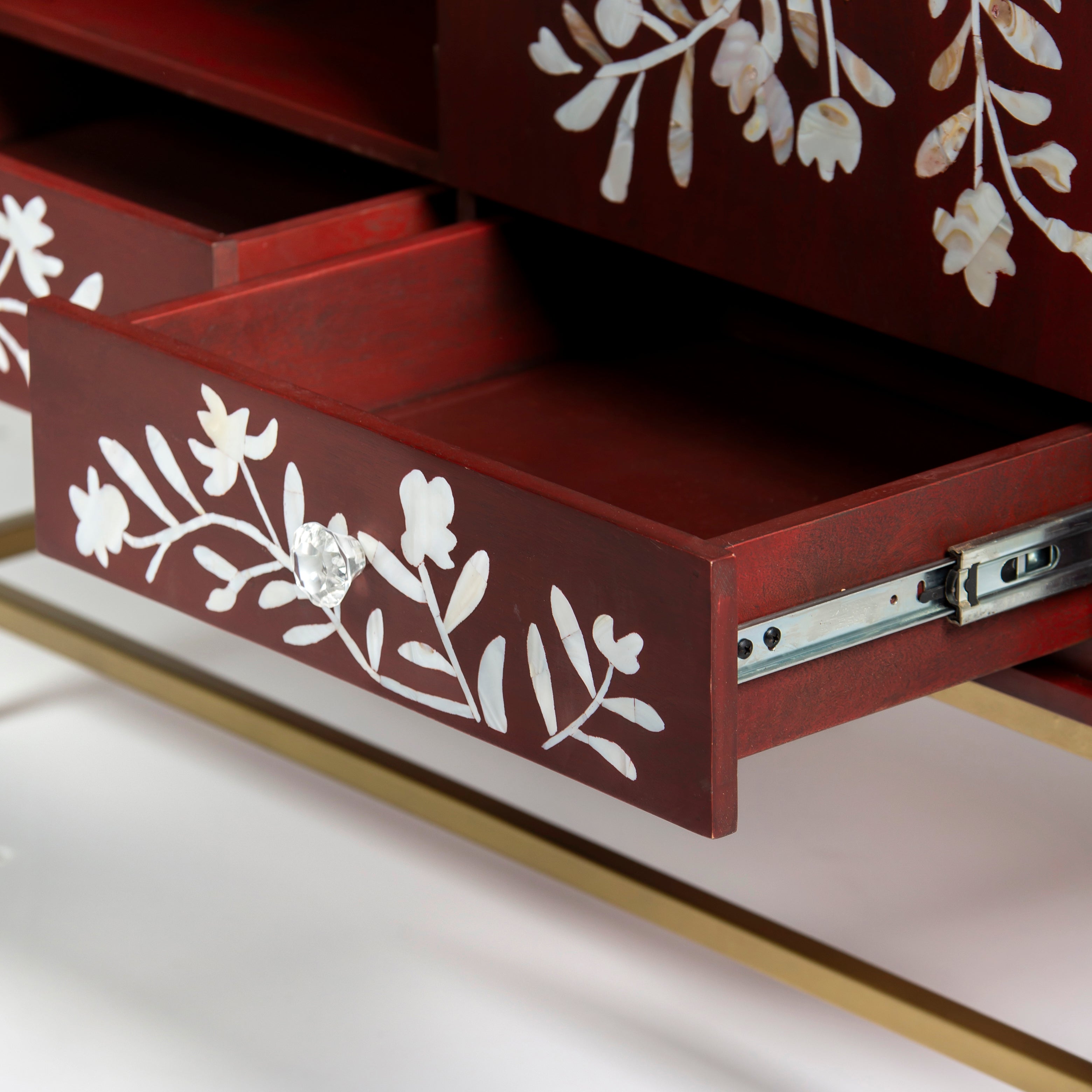 Mother of pearl inlay cabinet featuring intricate floral vine pattern in burgundy and white, handcrafted furniture piece
