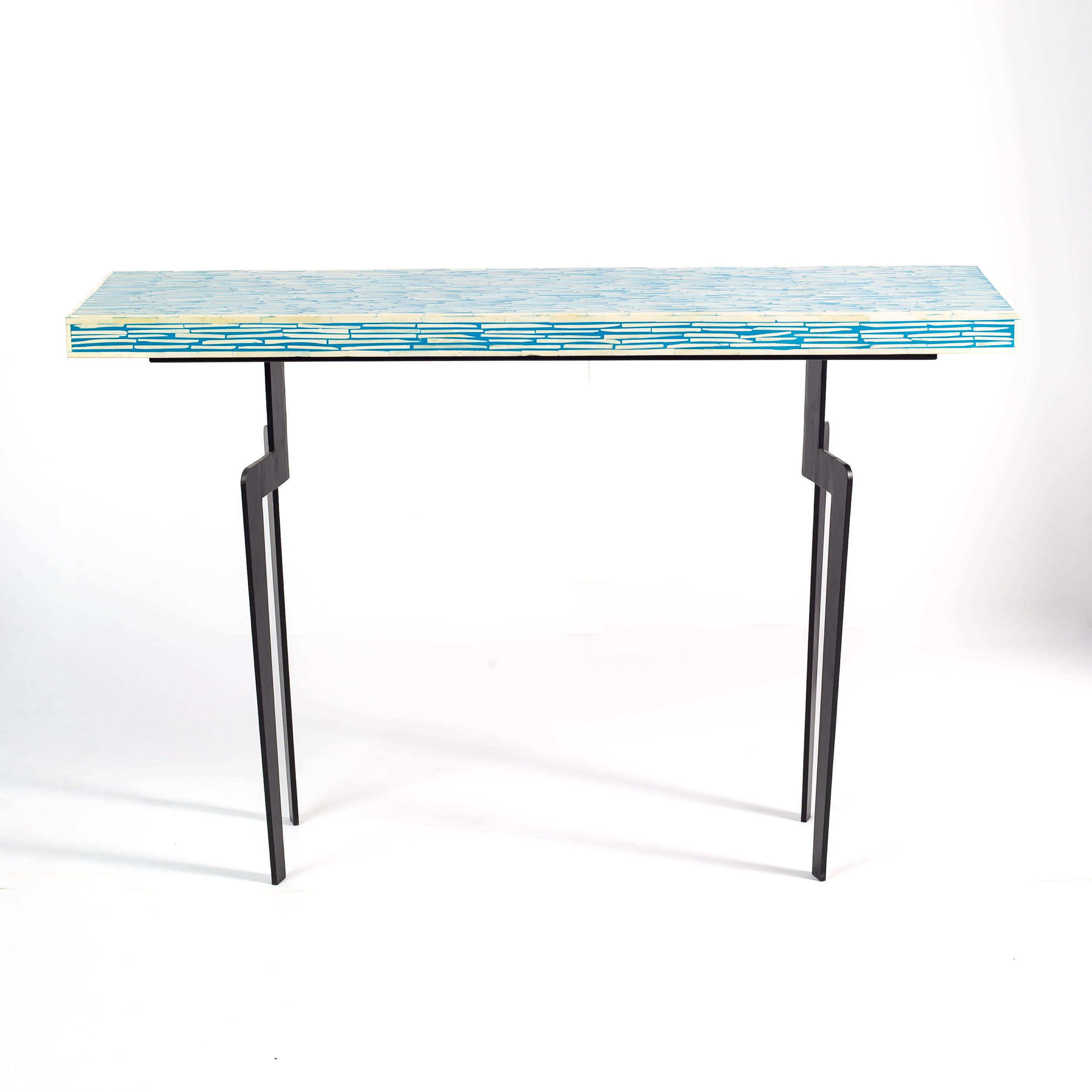 Table with a blue patterned top on a white background