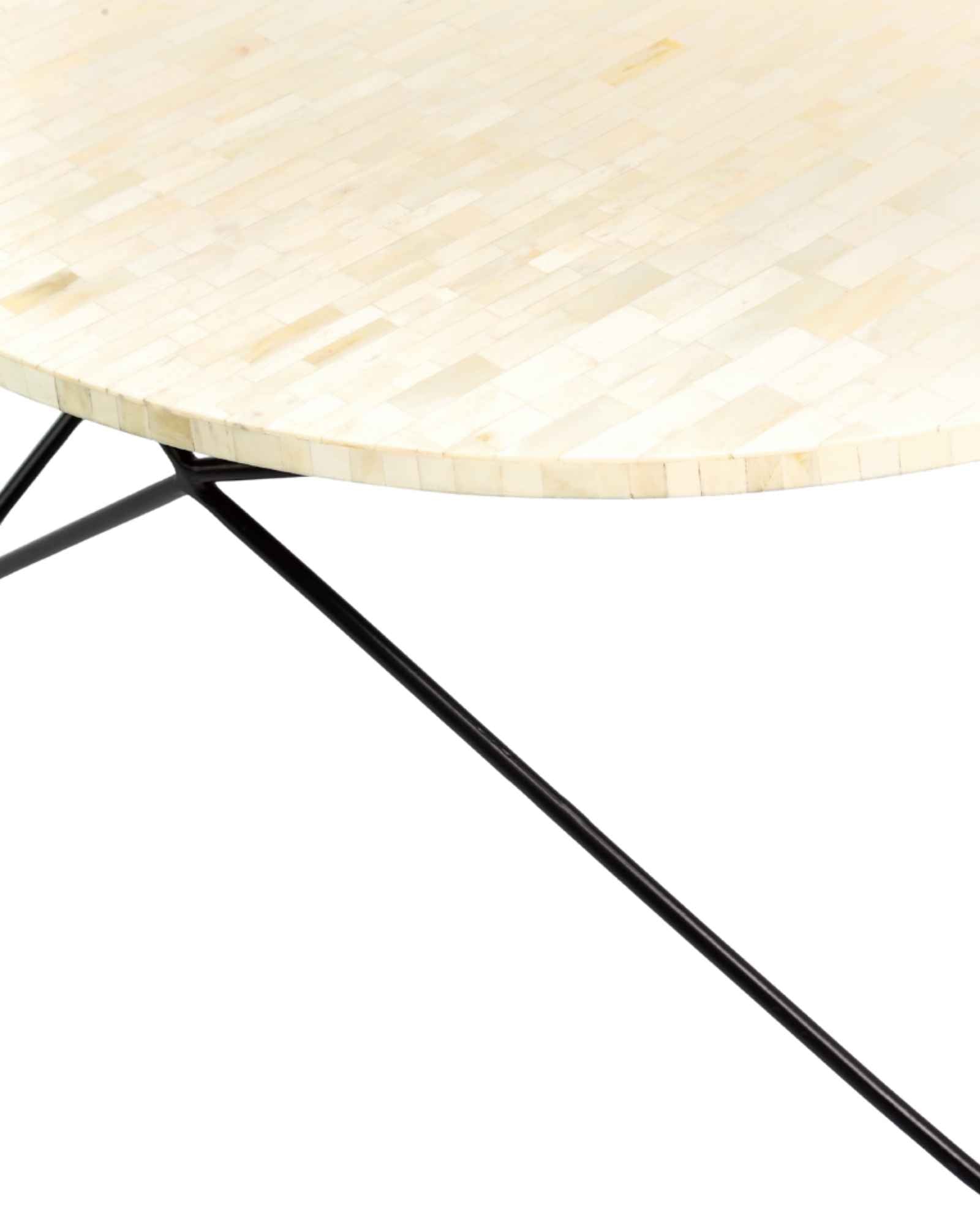 Ivory bone carved coffee table with linear textured surface and angular black metal base by Tabeer Homes.