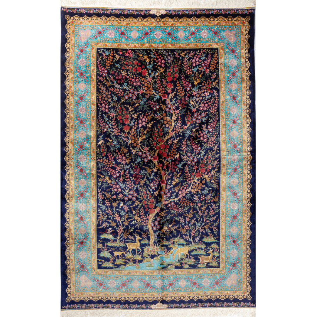 Silk Persian rug in navy with crimson, pink, jade, and gold floral design. Tree-of-life motif. Size: 225x150 cm. Ships worldwide.