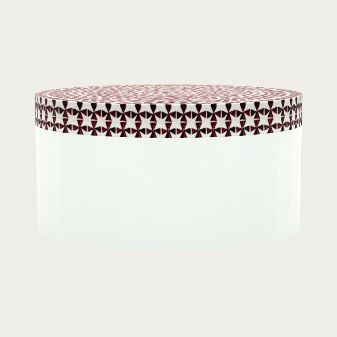 Round red bone inlay coffee table featuring a vibrant mosaic pattern on the top and sides. Perfect for modern and eclectic interiors.