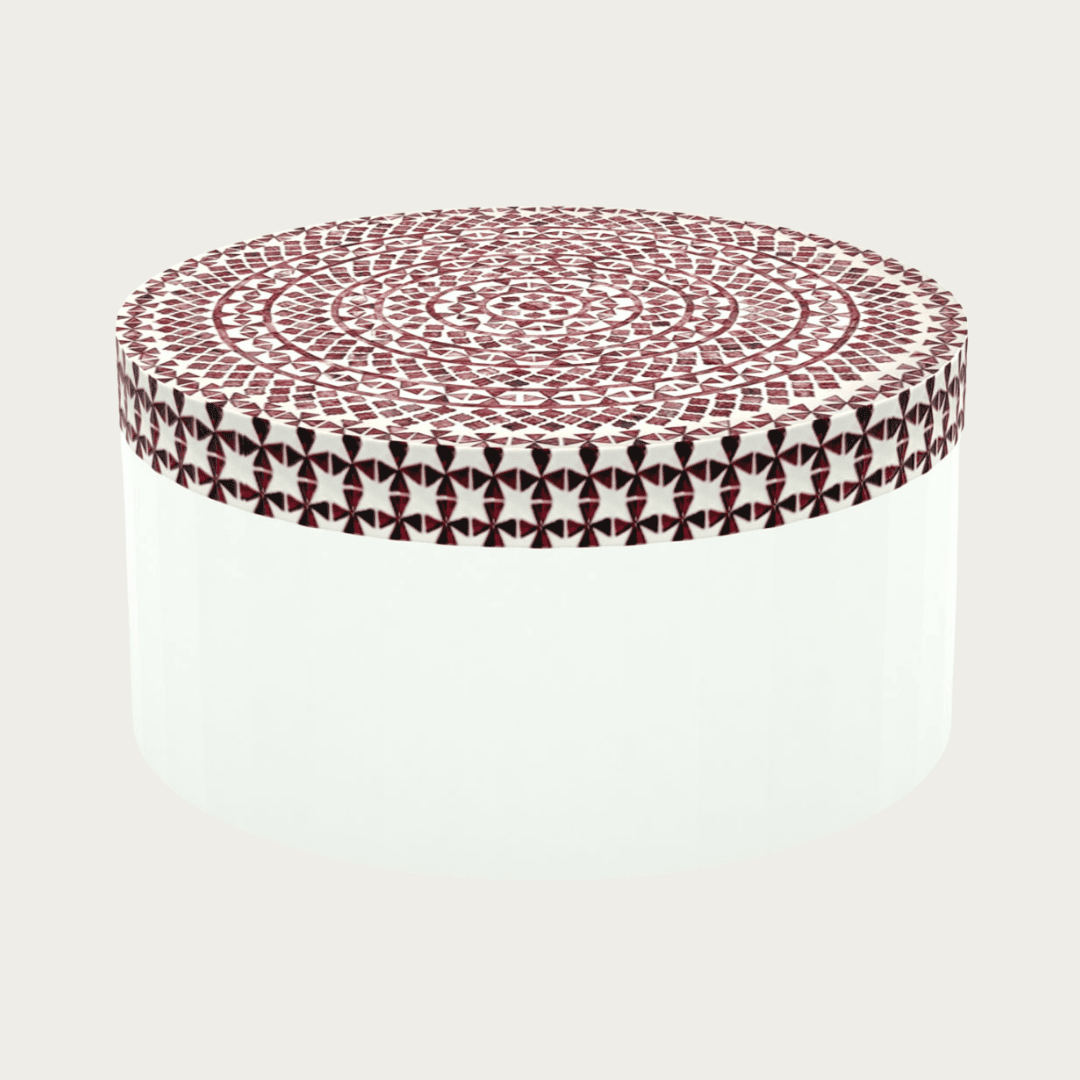 Round red bone inlay coffee table featuring a vibrant mosaic pattern on the top and sides. Perfect for modern and eclectic interiors.