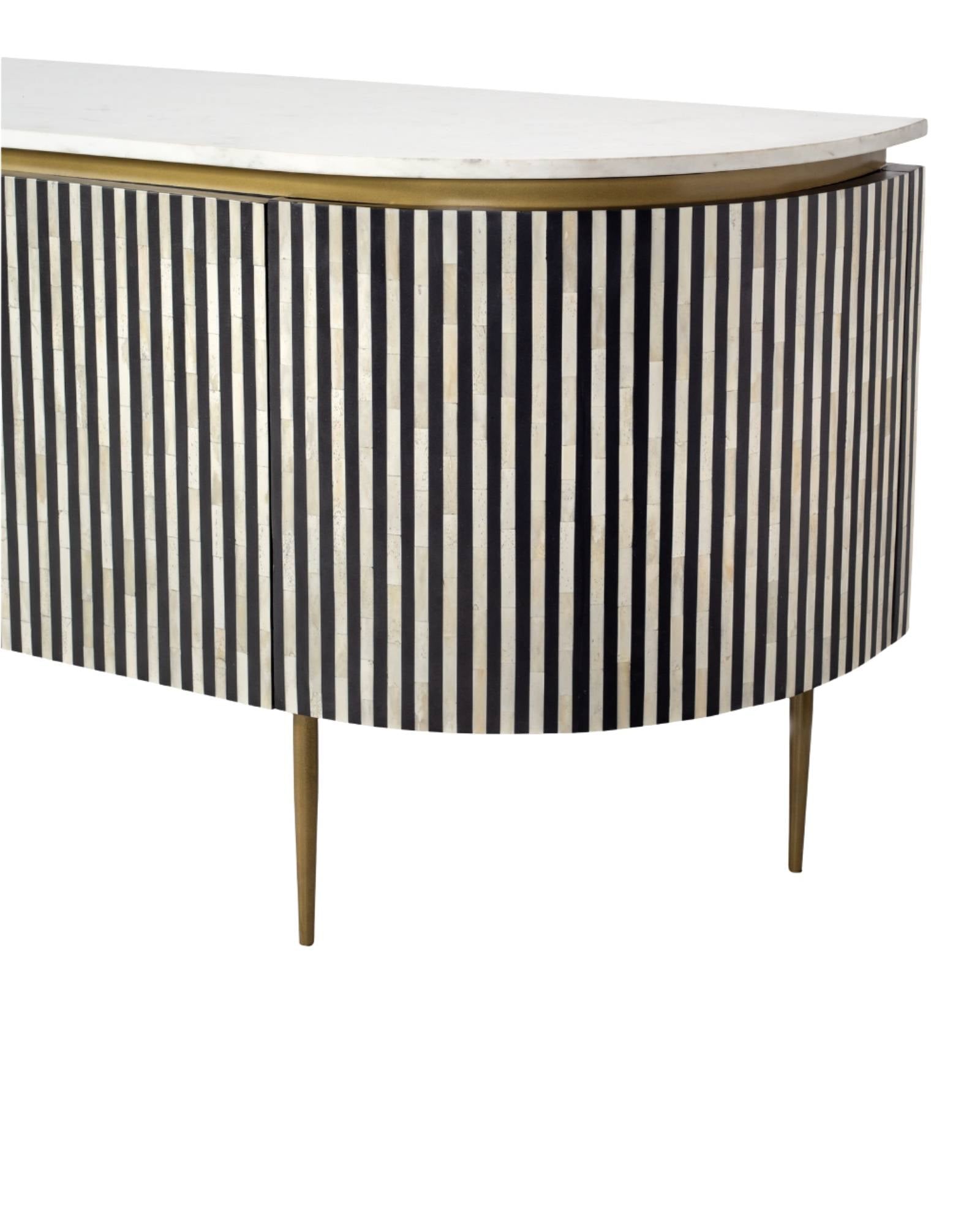 Black bone inlay sideboard with white marble top and brass legs, handcrafted with vertical striping and curved silhouette, luxury interior furniture.