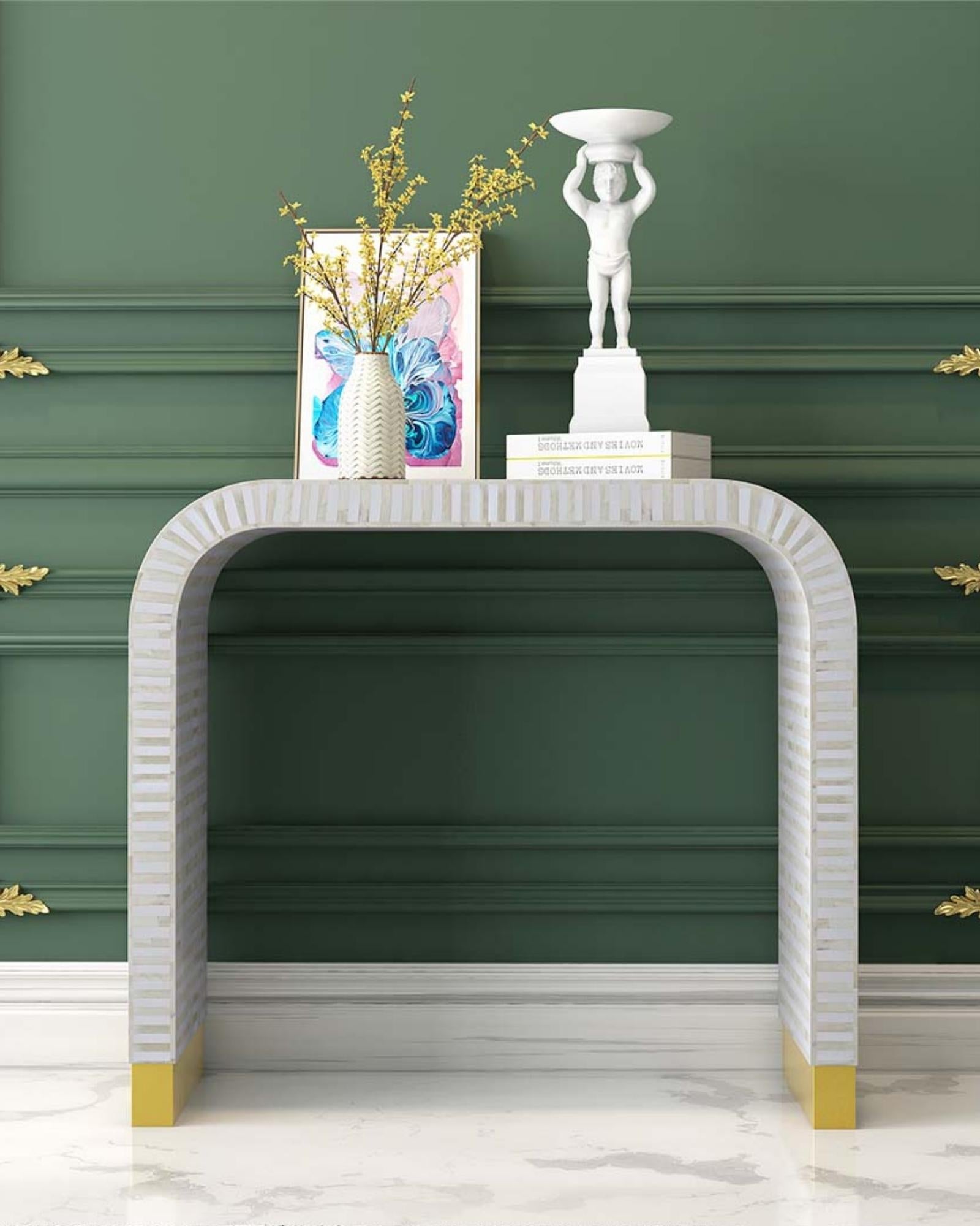 Elegant white bone inlay console with intricate detailing and a modern curved silhouette.