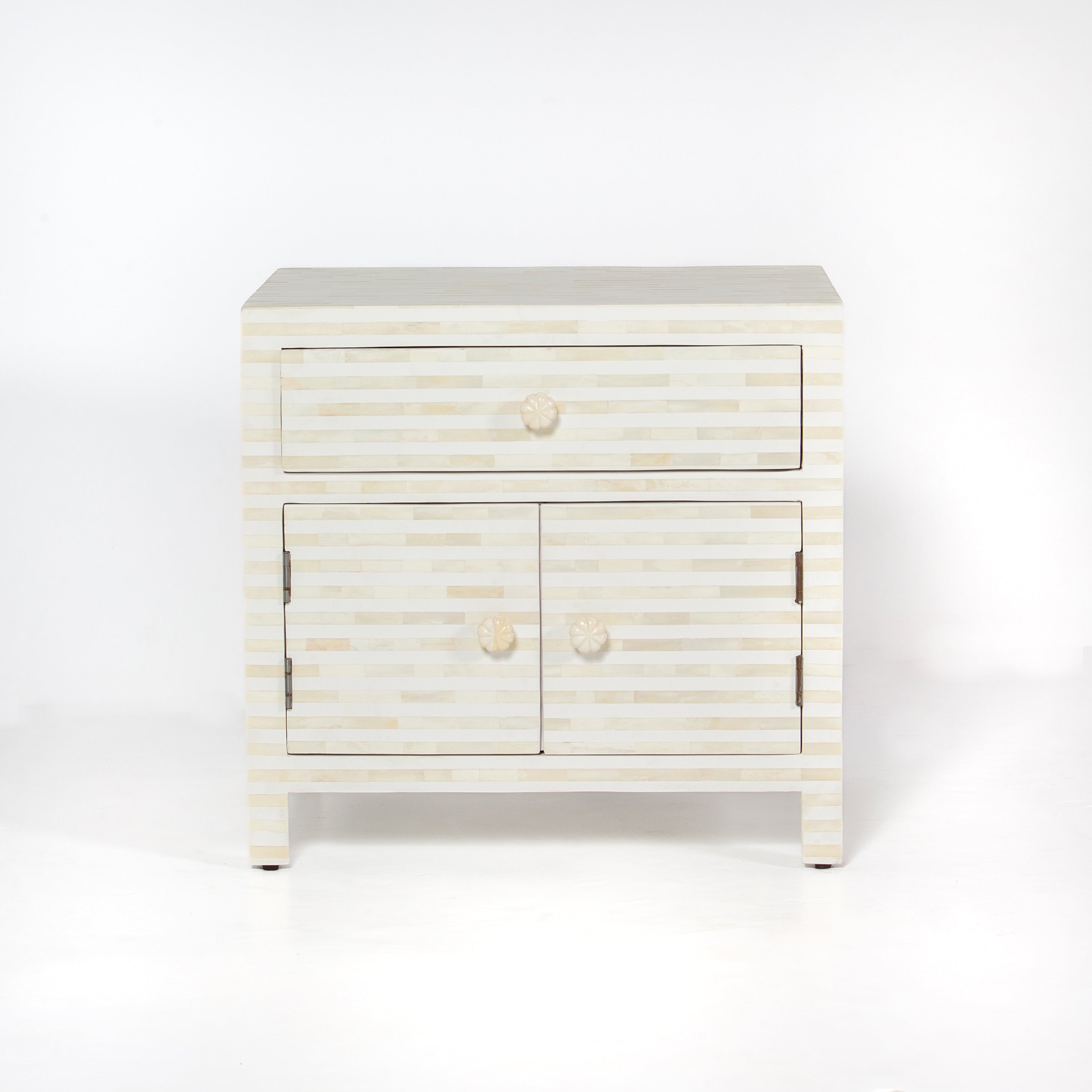 The Saphed Side Drawer features white bone inlay with cabinet doors and a drawer. A graceful accent for luxury interiors.