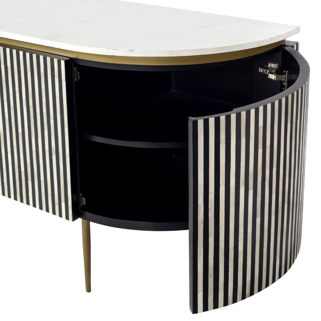 Black bone inlay sideboard with white marble top and brass legs, handcrafted with vertical striping and curved silhouette, luxury interior furniture.