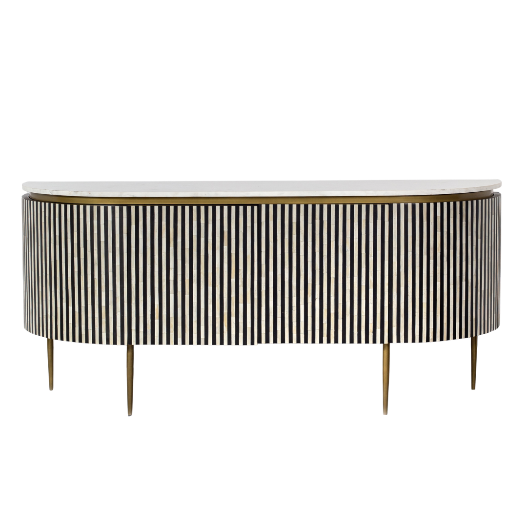 Black bone inlay sideboard with white marble top and brass legs, handcrafted with vertical striping and curved silhouette, luxury interior furniture.