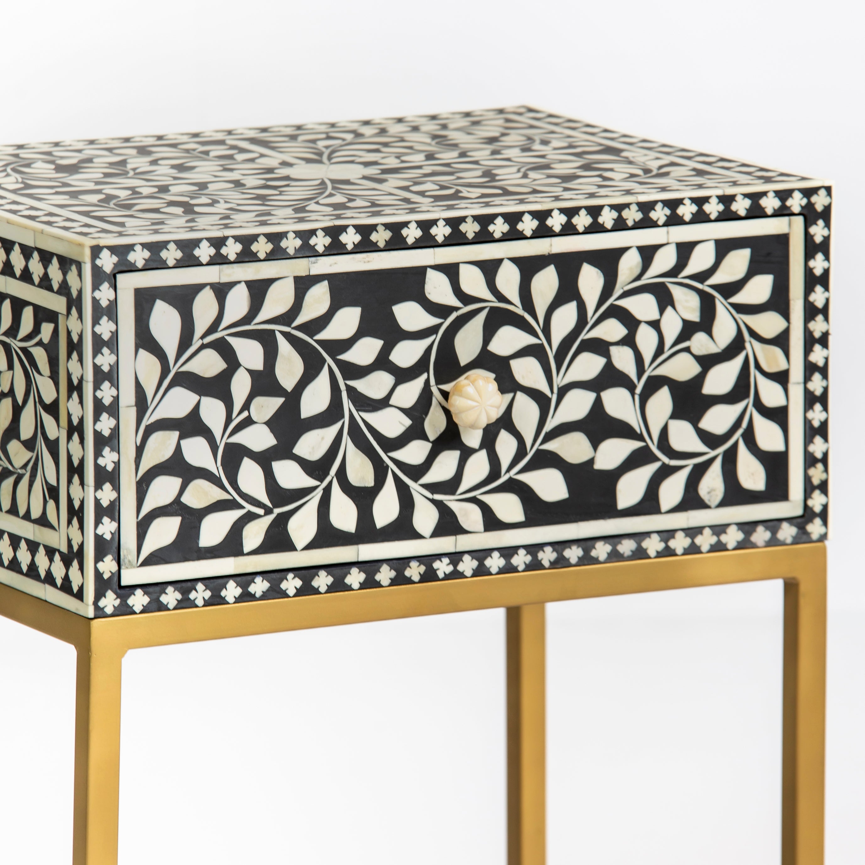 Bone inlay side drawer featuring floral vine pattern in black and white with metal base, handcrafted furniture piece
