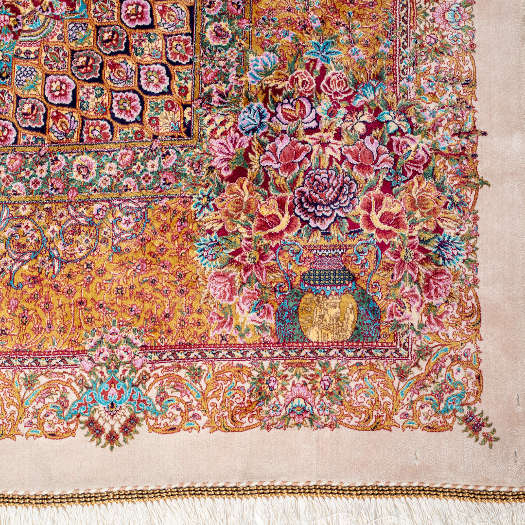 Silk Persian rug with a floral rosette medallion, ivory base, and ornate border in saffron, turquoise, plum, and blush tones.