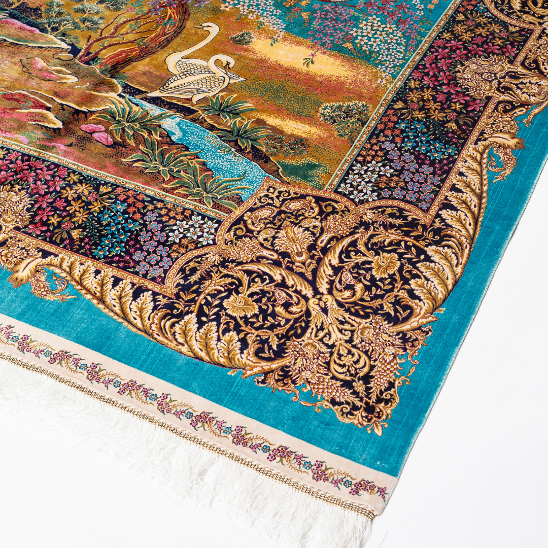 Luxurious silk rug with turquoise base, floral borders, and tree of life with colorful birds and swans.