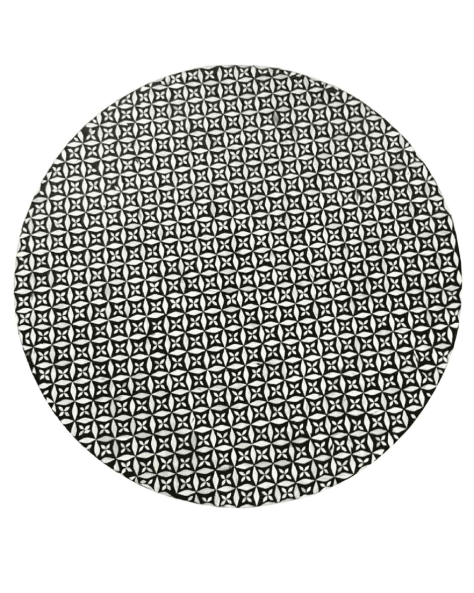 Round black bone inlay coffee table with intricate floral pattern and bold gold base. A modern, stylish centerpiece for any room.