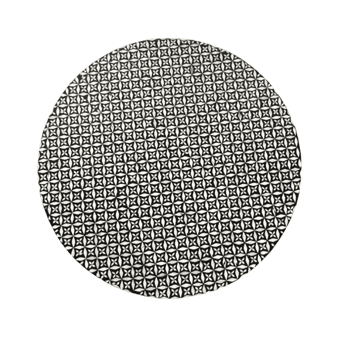 Round black bone inlay coffee table with intricate floral pattern and bold gold base. A modern, stylish centerpiece for any room.