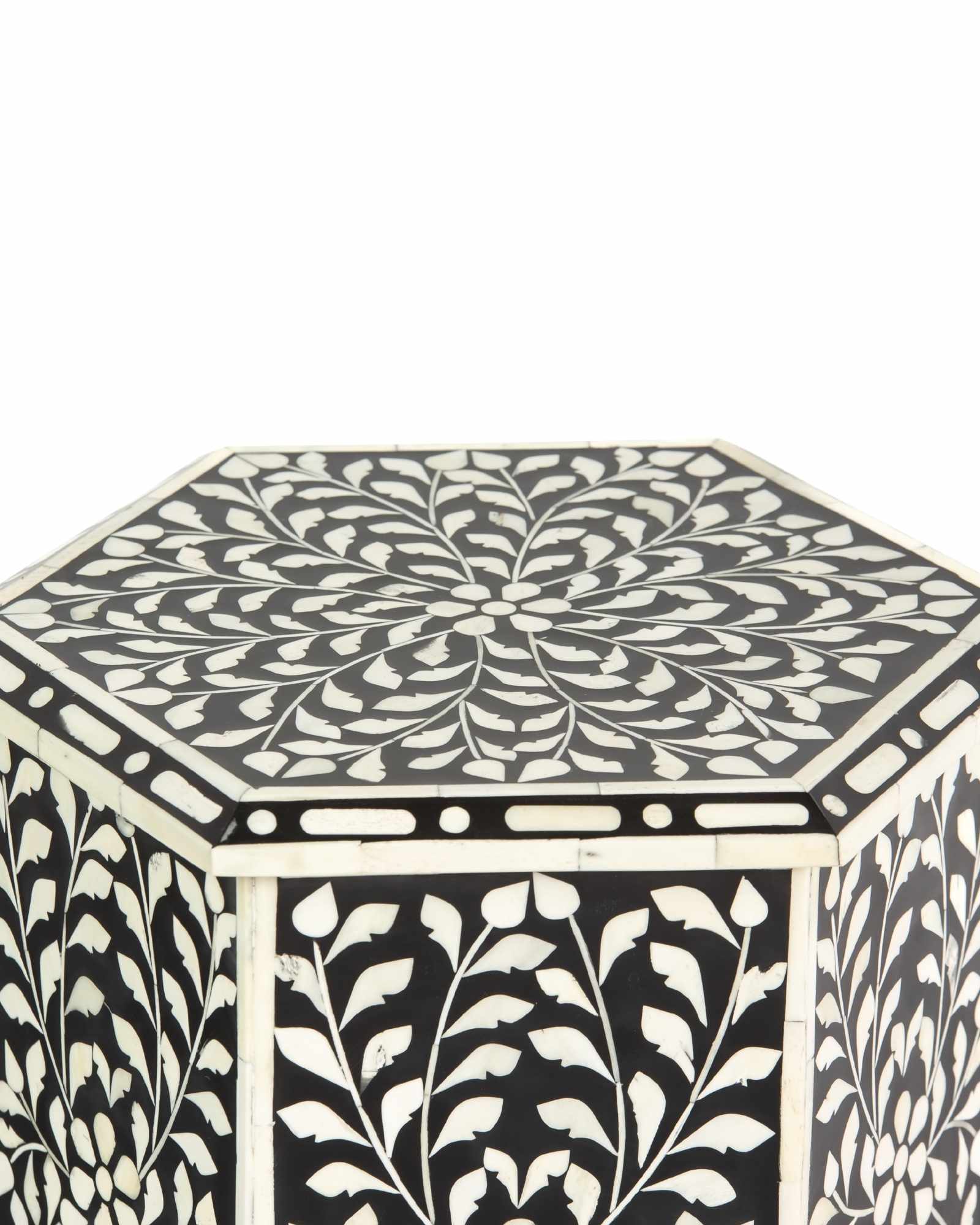 Handcrafted Yasmine side table in black bone inlay with a hexagonal form and arched legs, perfect as a refined accent piece.