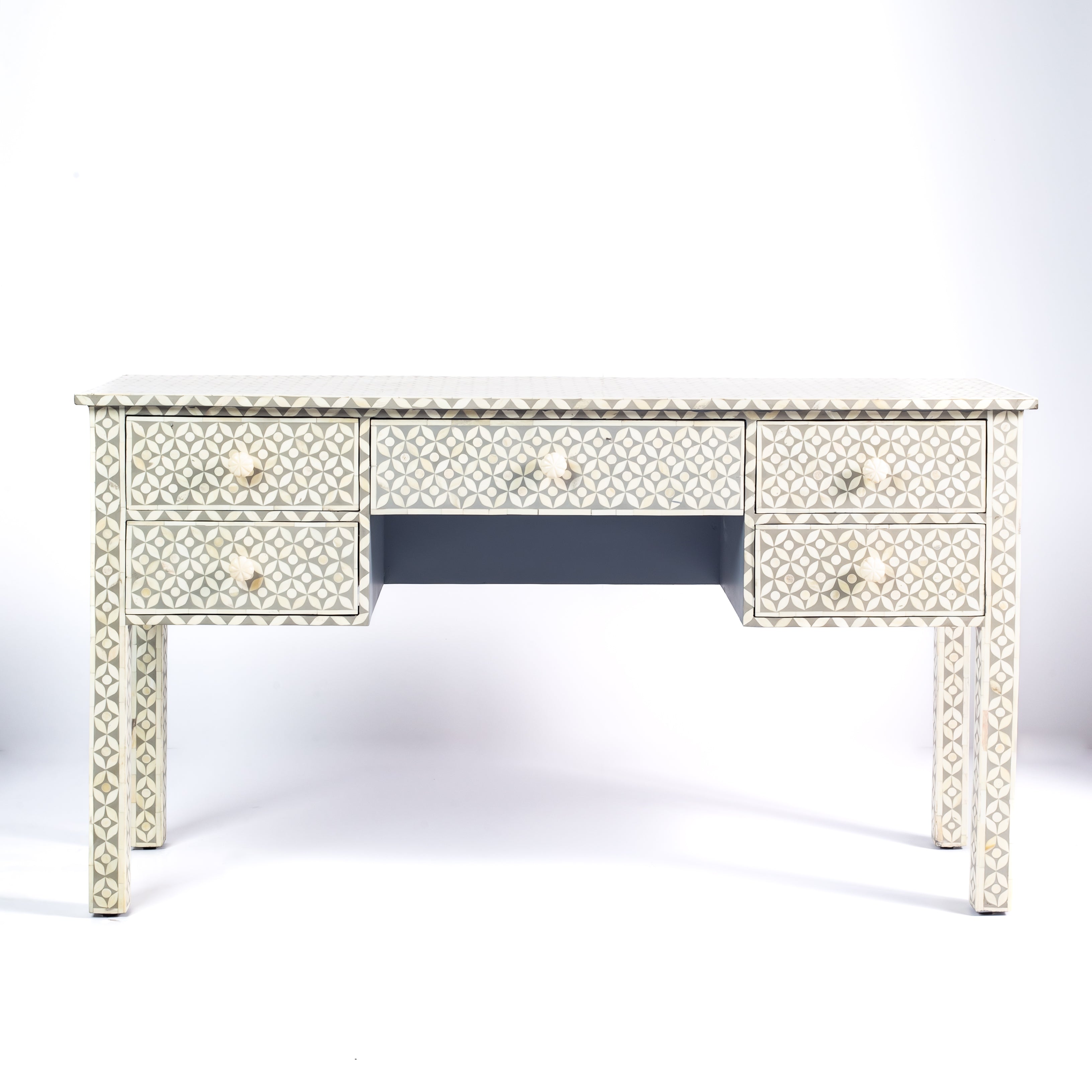 Grey bone inlay console desk with five drawers and geometric design, handcrafted with detailed knobs and artisan craftsmanship.