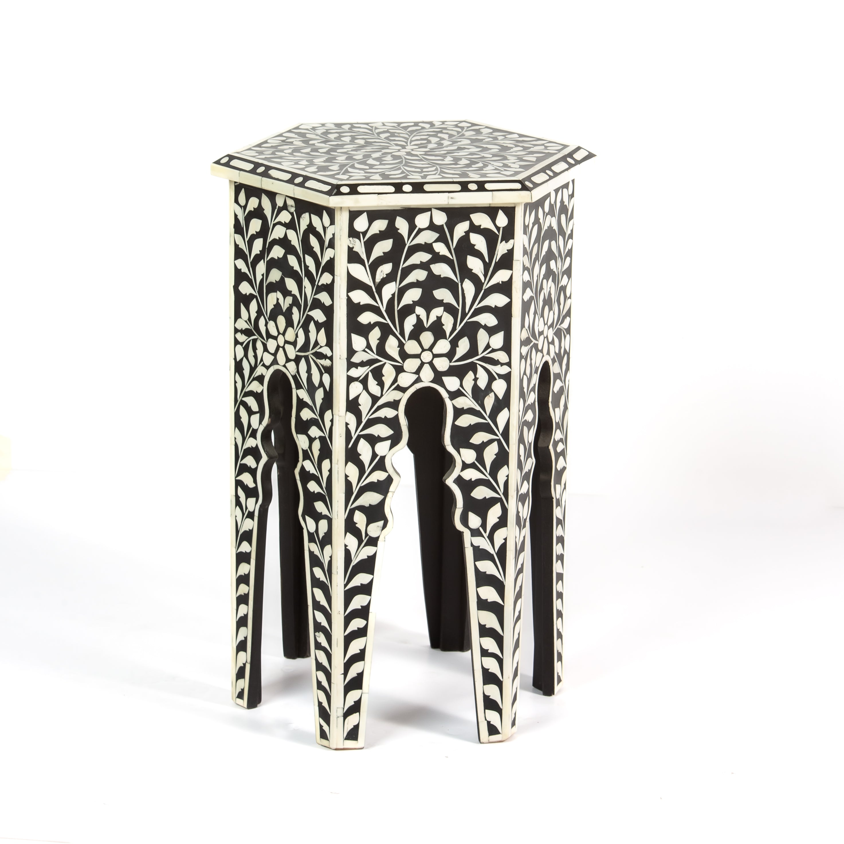 Handcrafted Yasmine side table in black bone inlay with a hexagonal form and arched legs, perfect as a refined accent piece.