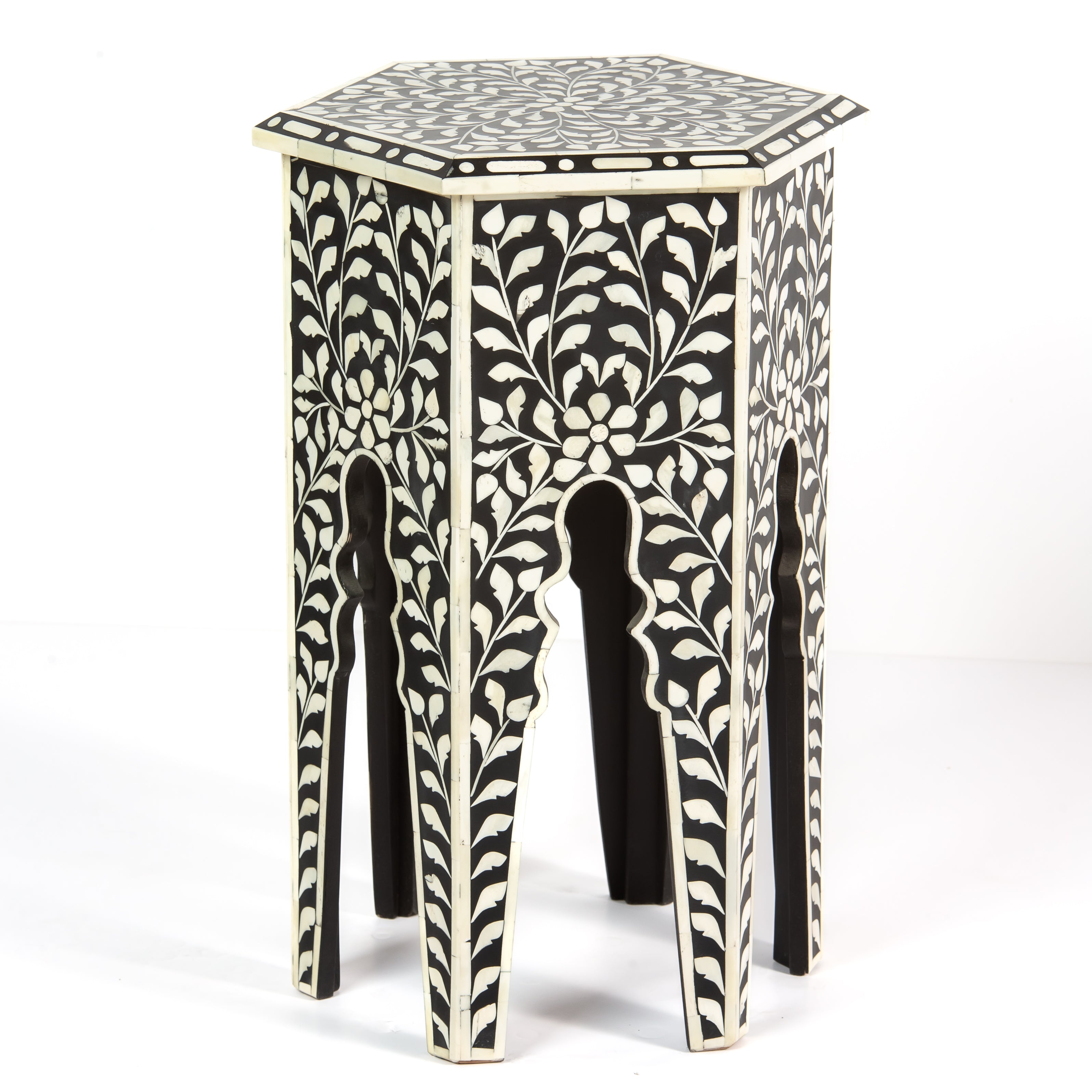 Handcrafted Yasmine side table in black bone inlay with a hexagonal form and arched legs, perfect as a refined accent piece.