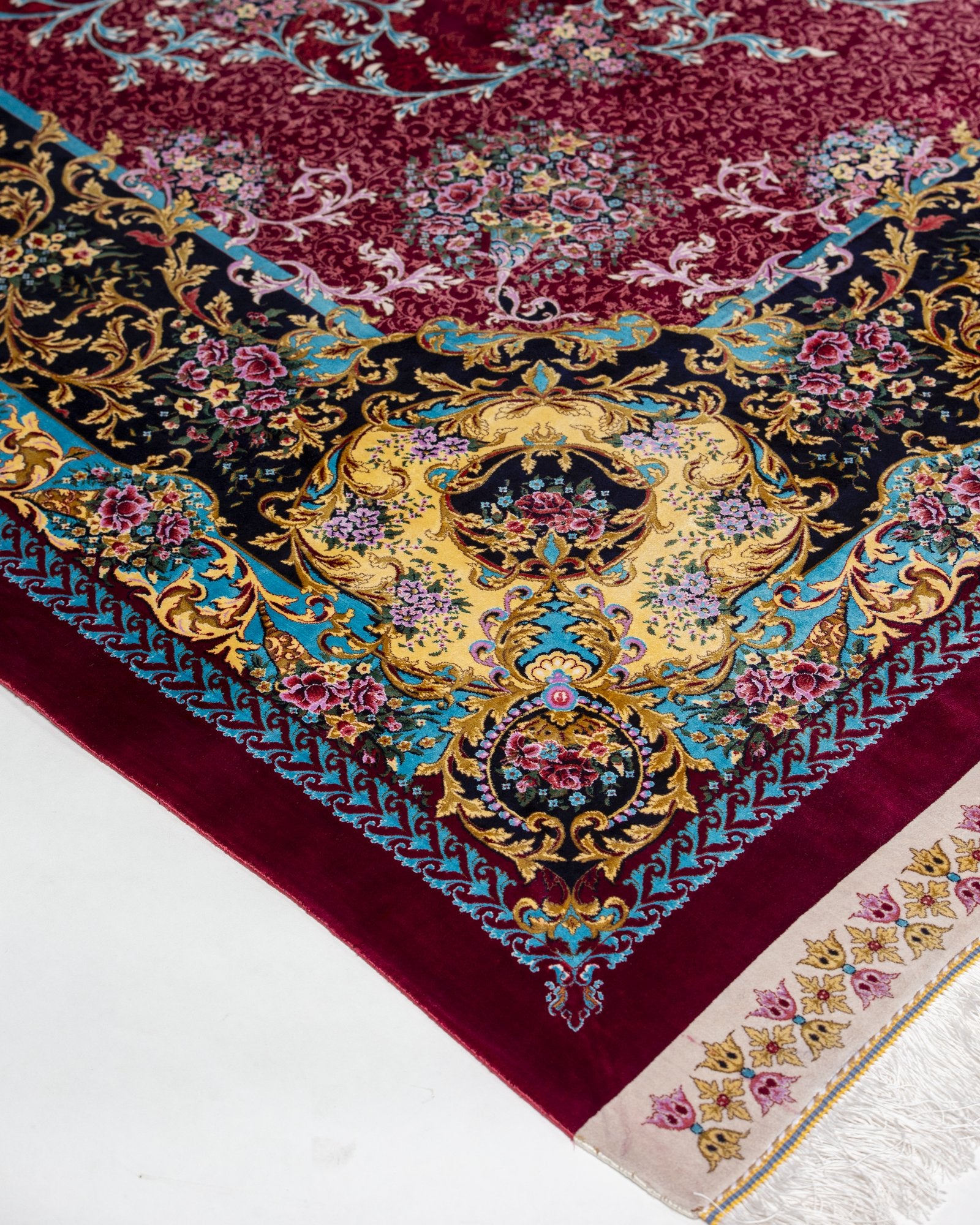 Almeria silk carpet angled view showing ruby red tones, 250 x 350 cm - Tabeer Homes Dubai