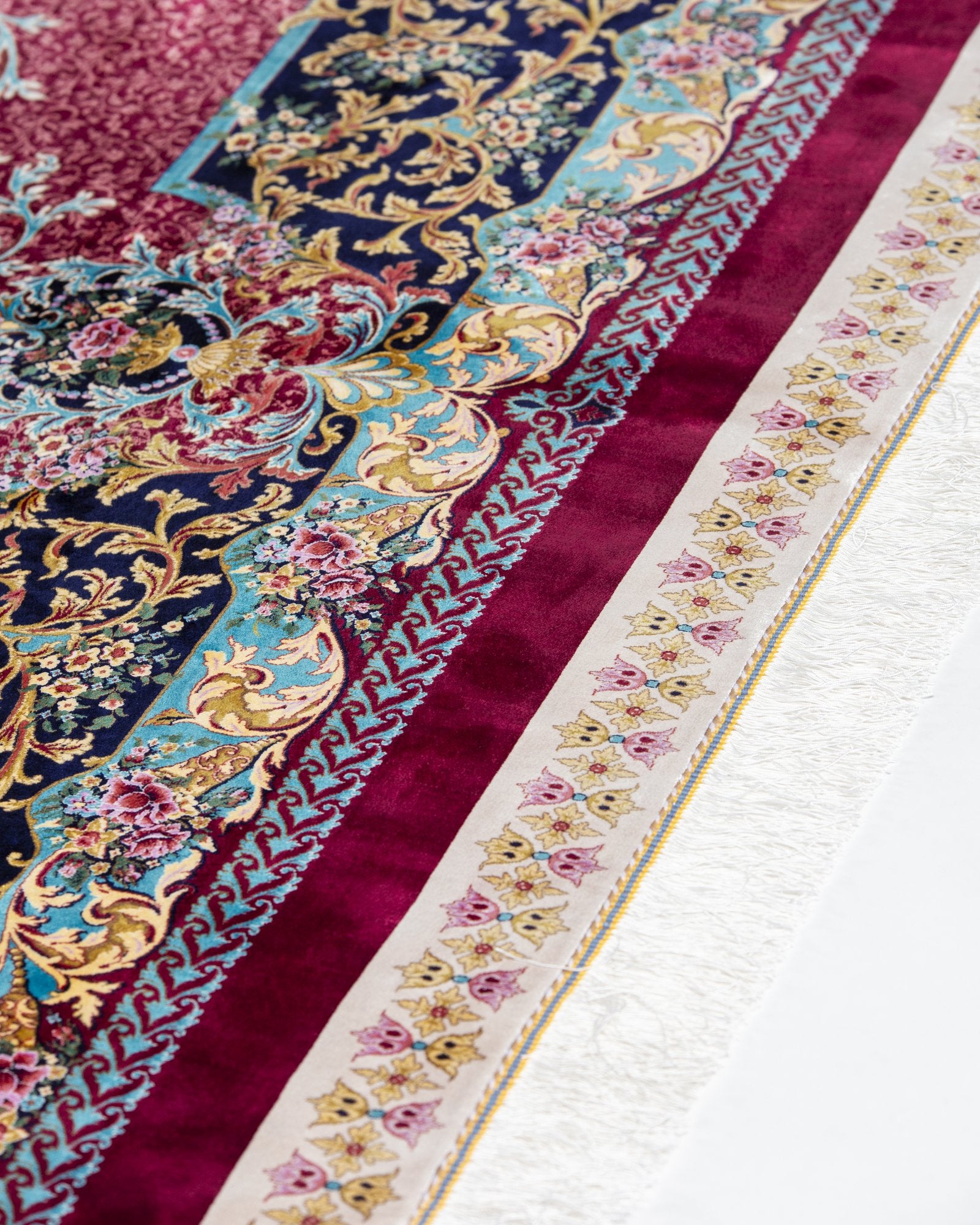 Almeria silk carpet floral motif close-up in ruby red, 250 x 350 cm - Tabeer Homes Dubai
