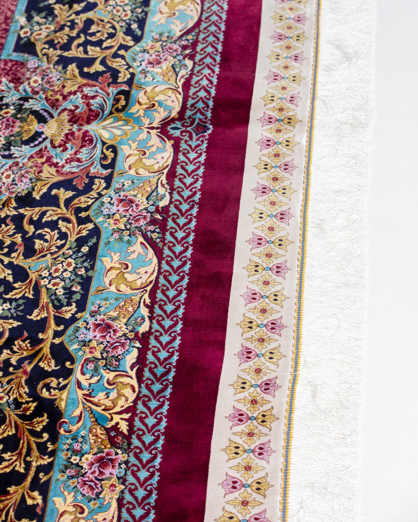 Almeria Persian silk rug folded corner showing fine weave, ruby red 250 x 350 cm - Tabeer Homes Dubai