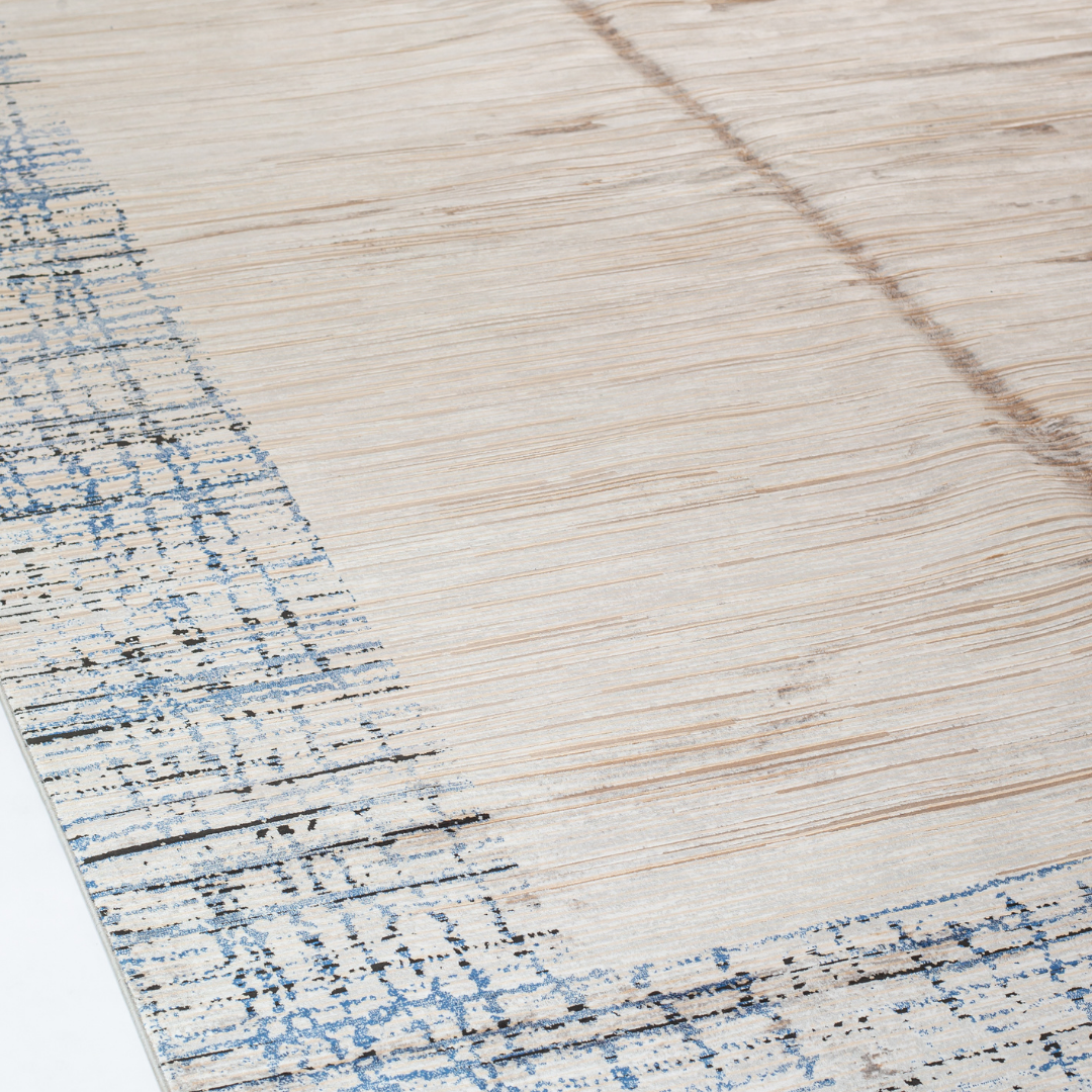 Alura cotton rug in 200x300 cms featuring a beige linear body with abstract navy border, modern and elegant in texture and tone.