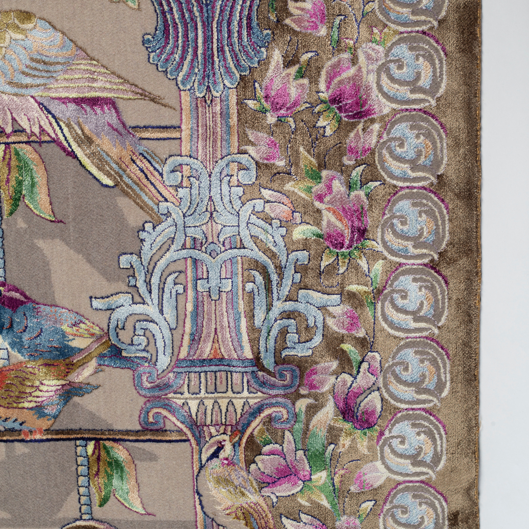 Handwoven silk rug featuring birds on a beige grid, floral corners, and classical columns. A joyful yet elegant statement piece.