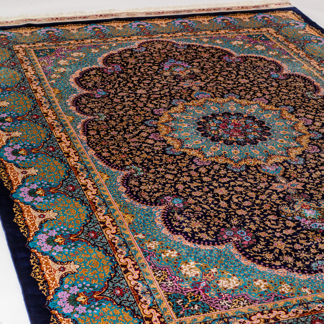 Azarine Silk Rug in 200x300 cm featuring a navy base, turquoise medallion, and intricate floral motifs.