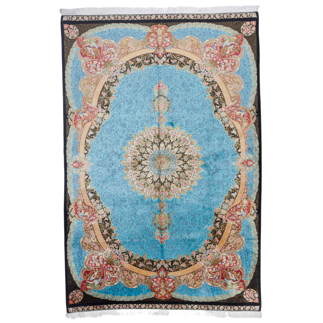 Luxury blue silk rug featuring a detailed central medallion, floral motifs, and ornate bird patterns in gold, coral, and black accents.