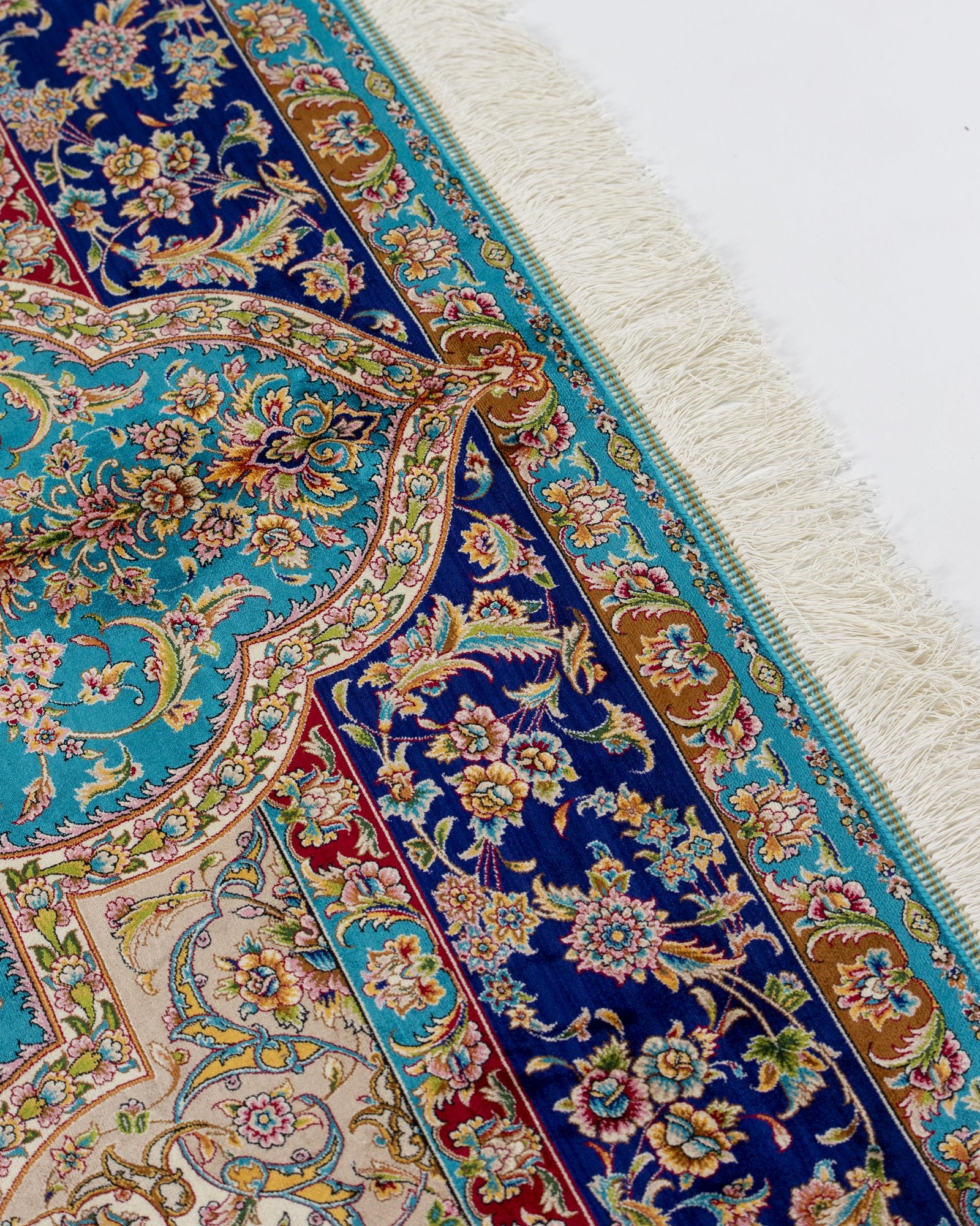 border pattern detail on the Marina turquoise silk rug