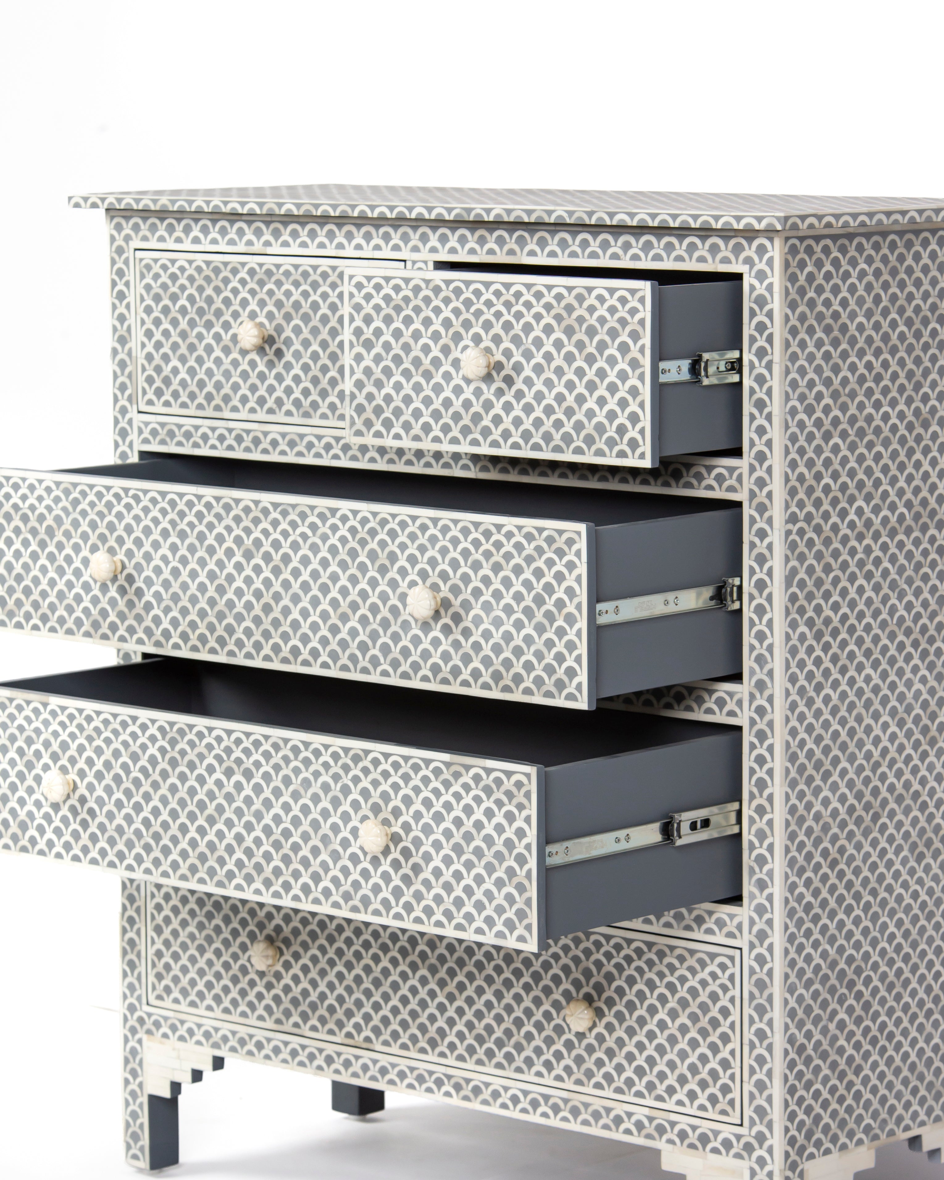 Basel grey chest of drawers with three drawers open on metal runners