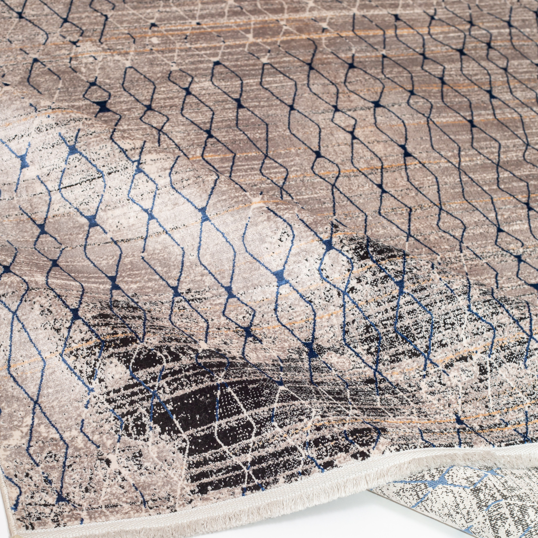 Caldre cotton Rug in 200x300 cms with a distressed ivory base, taupe texture, and navy geometric lattice design, perfect for contemporary living spaces.