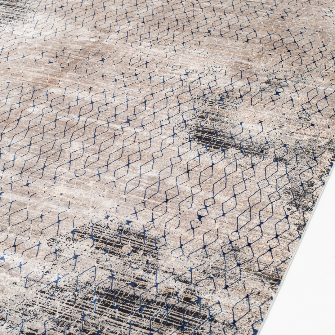 Caldre cotton Rug in 200x300 cms with a distressed ivory base, taupe texture, and navy geometric lattice design, perfect for contemporary living spaces.