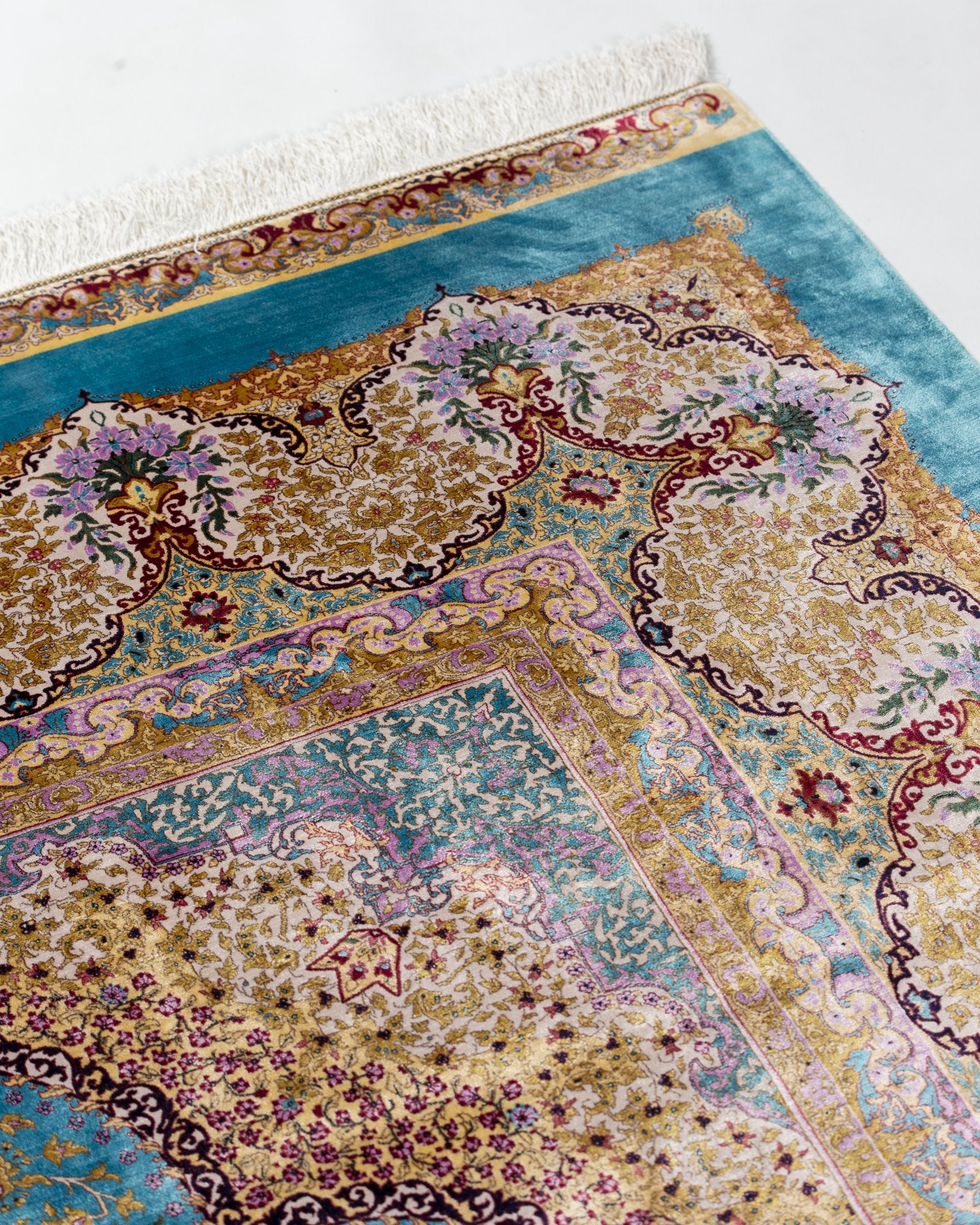 Camilla silk carpet angled view showing aqua blue tones, 200 x 300 cm - Tabeer Homes Dubai