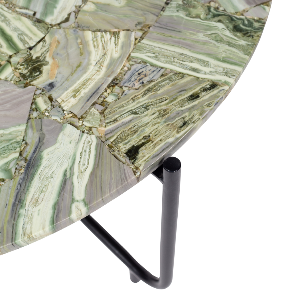 Handcrafted agate coffee table with round stone top and black metal base, artisan-made heritage piece.