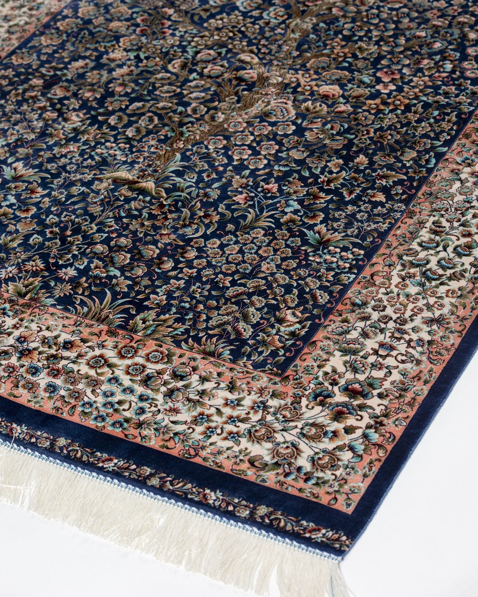 detail of the floral field on the Delkash blue silk rug