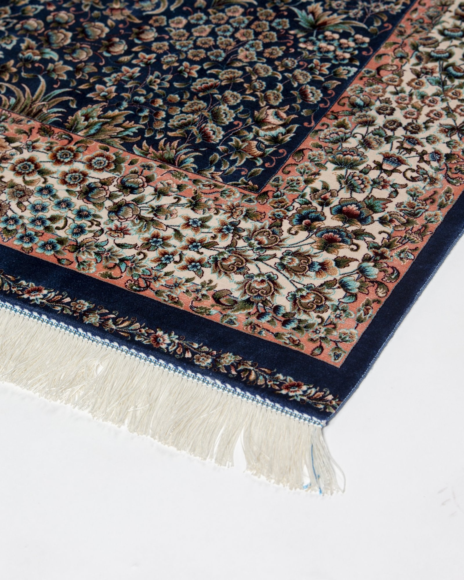 border and field detail on the Delkash blue silk rug