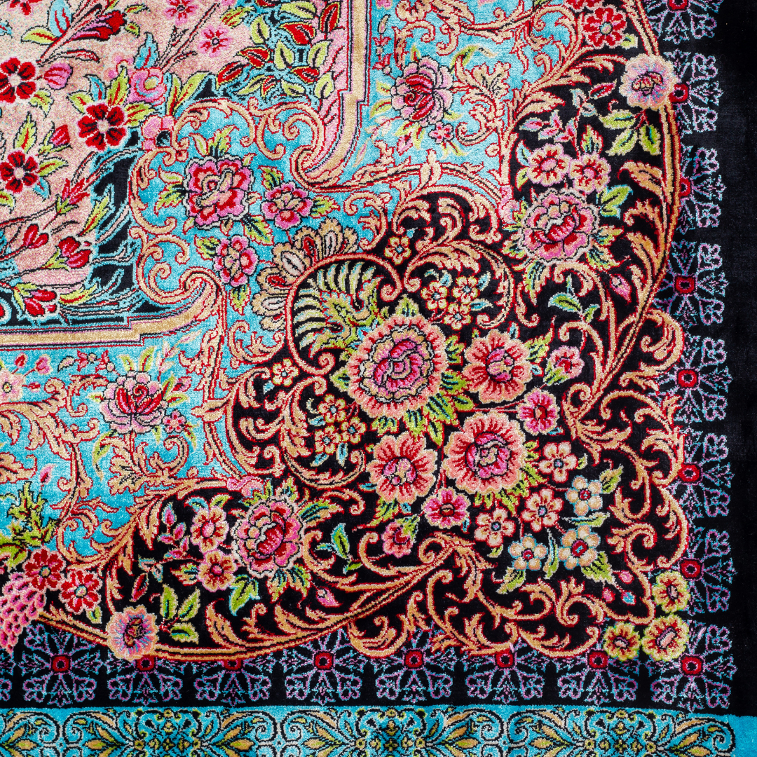 Elara Silk Rug featuring nature-inspired artwork with birds, flowers, and flowing water on an ivory base with turquoise and black borders, 150x100 cm.