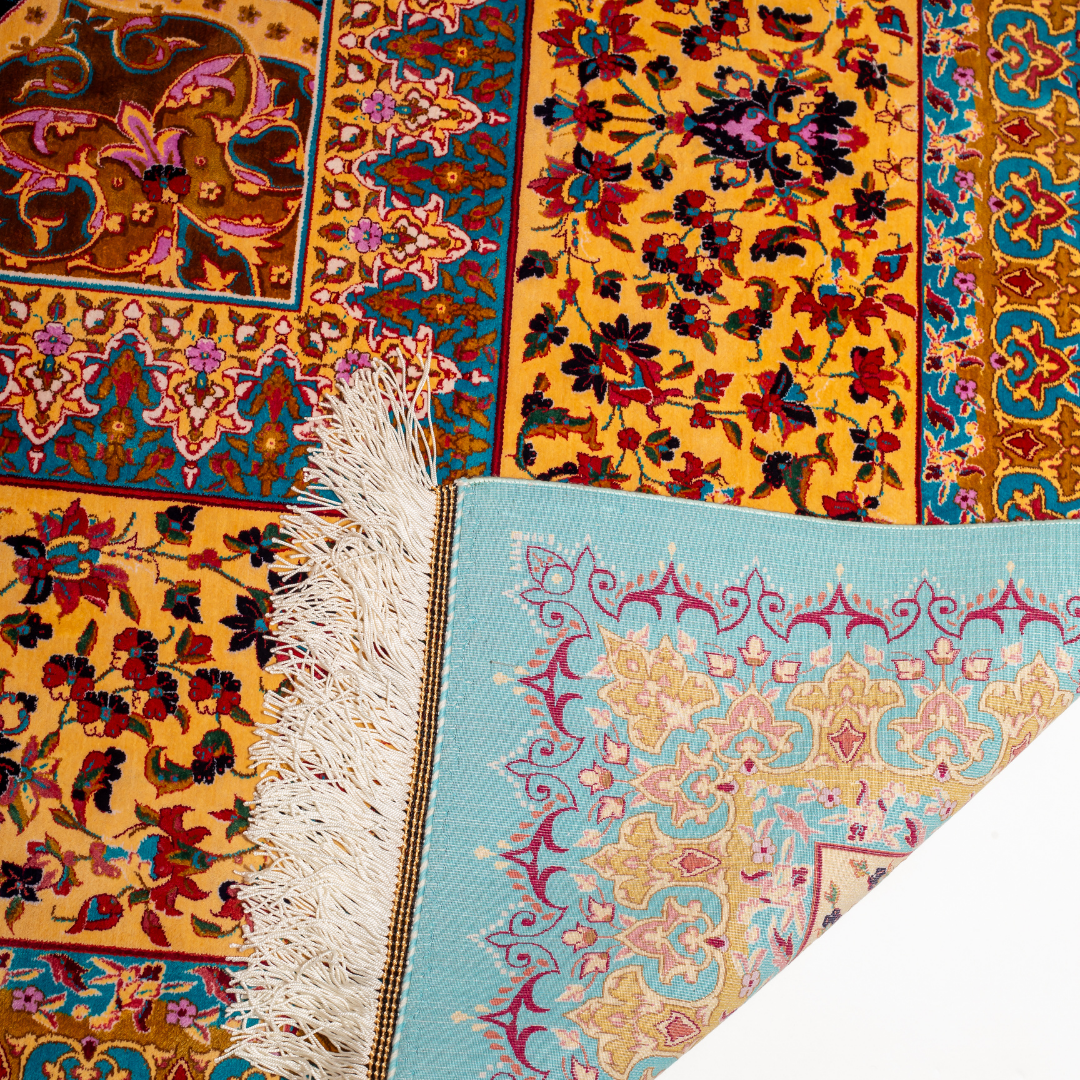 Elowen silk rug in 350x250 cms featuring turquoise and mustard floral designs with a detailed medallion and golden border work.