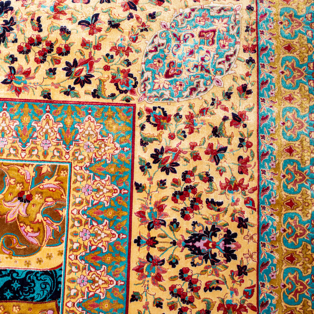 Elowen silk rug in 350x250 cms featuring turquoise and mustard floral designs with a detailed medallion and golden border work.