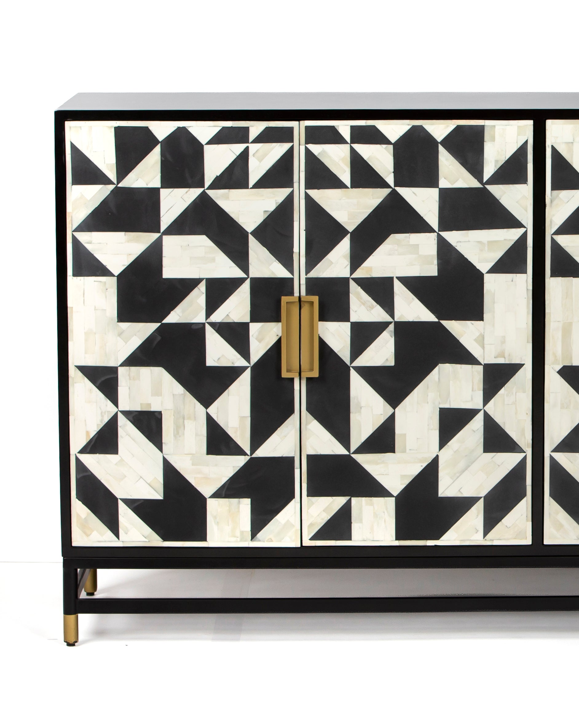 Geometric bone inlay door fronts with brass handles on Eve cabinet