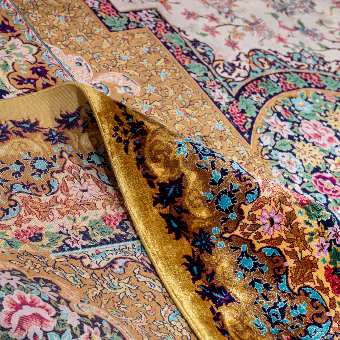 Gavriel silk rug in 400x300 cms featuring a golden base with multicolour floral medallion designs and modern abstract detailing.