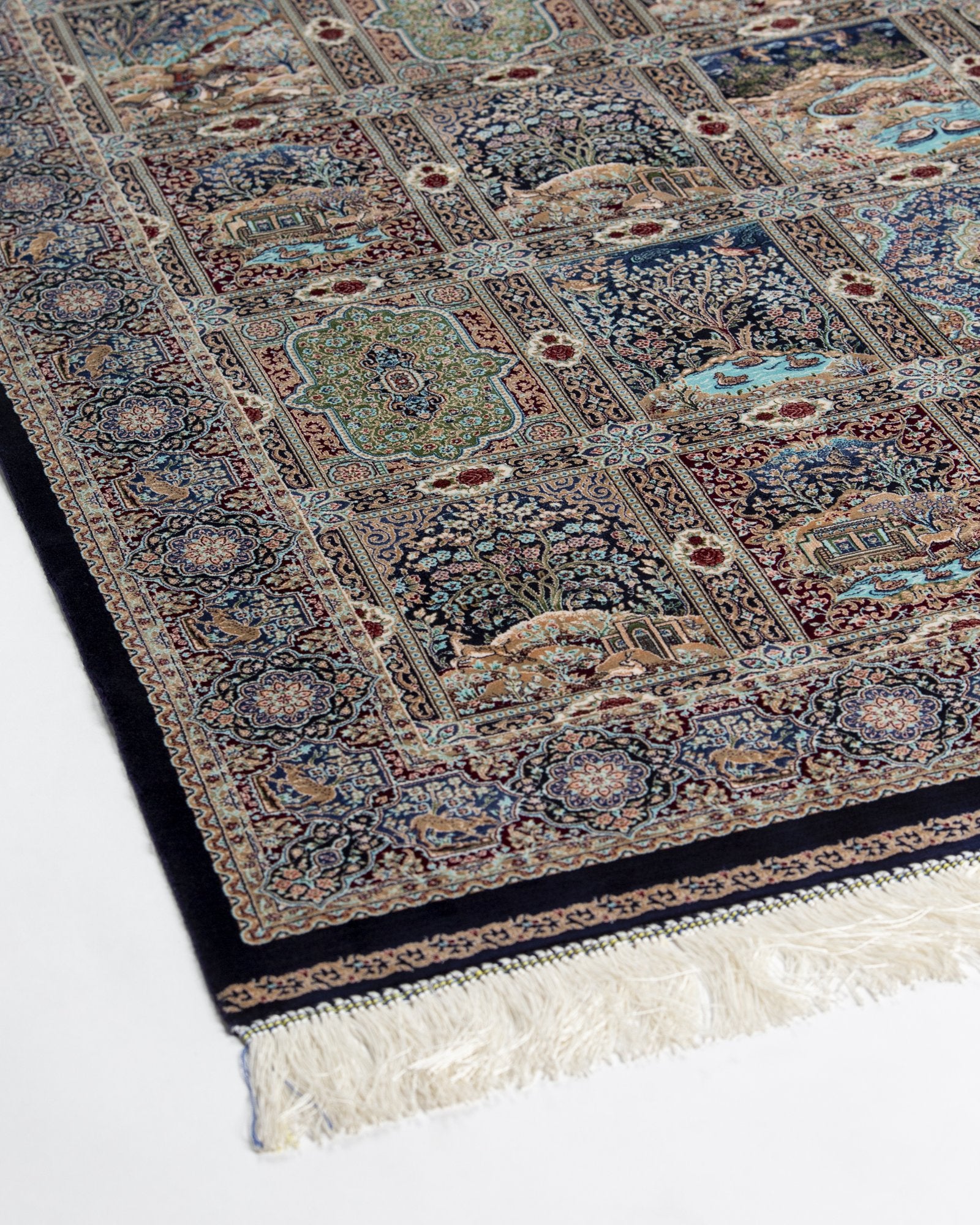 detail of the garden panel on the Golbahar navy silk rug