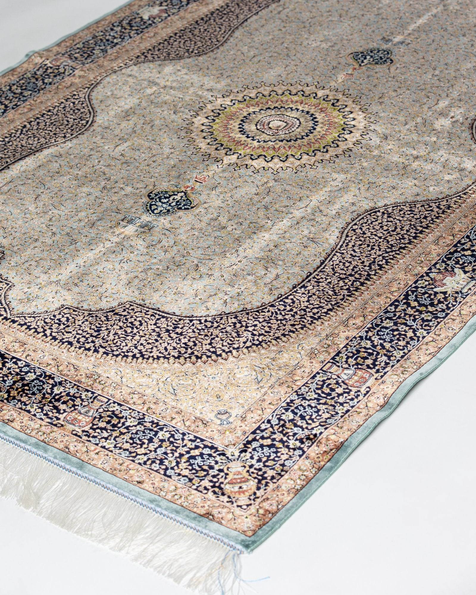 detail of the sunburst medallion on the Celeste taupe silk rug