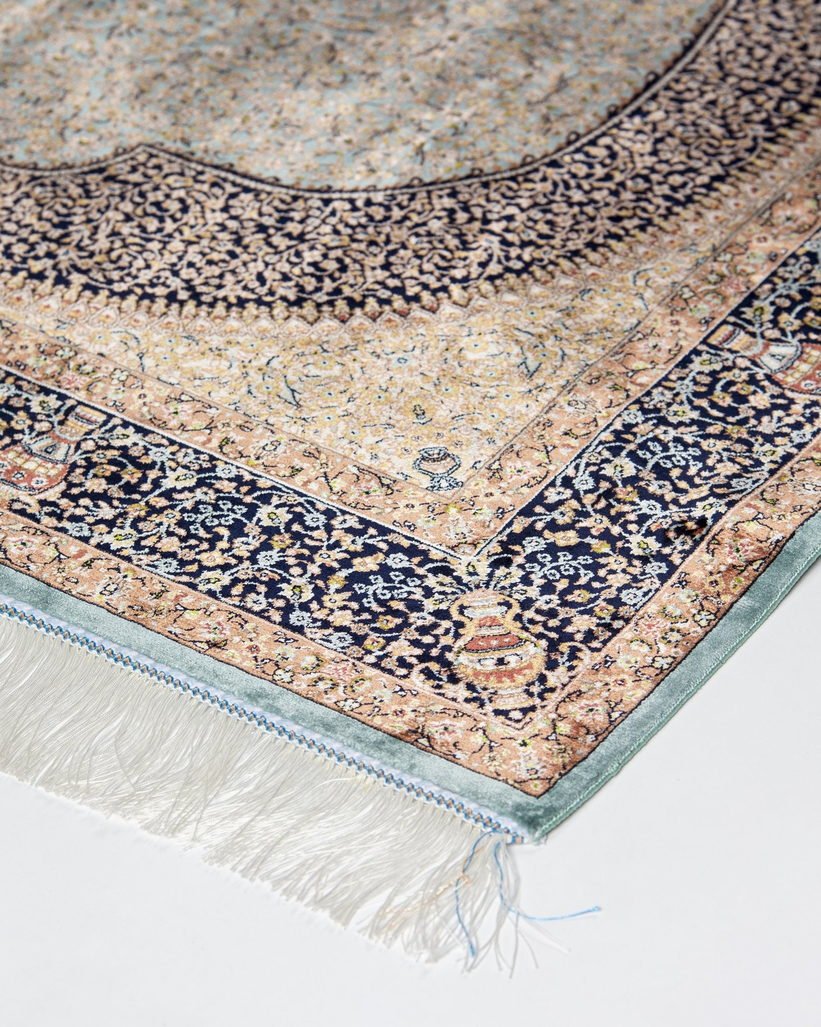 border and field detail on the Celeste taupe silk rug