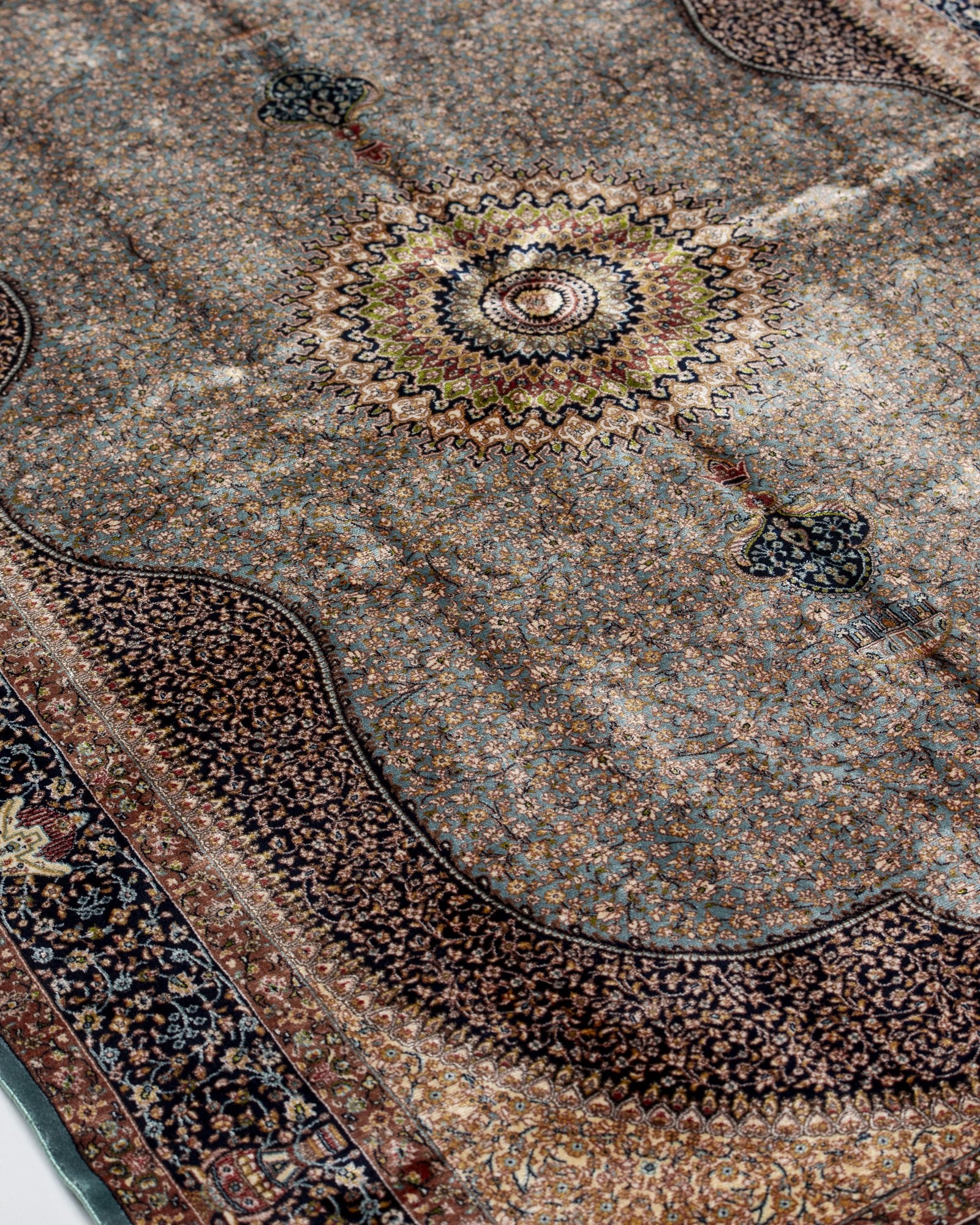 reverse showing the fine silk weave on the Celeste taupe silk rug