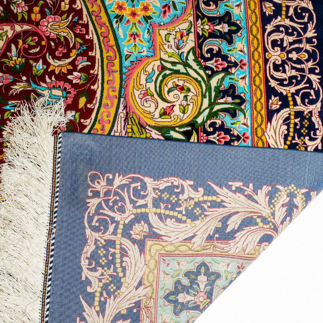 High-detail silk rug featuring a central medallion, ornate paisleys, and floral motifs in jewel tones. Perfect for elegant interiors.