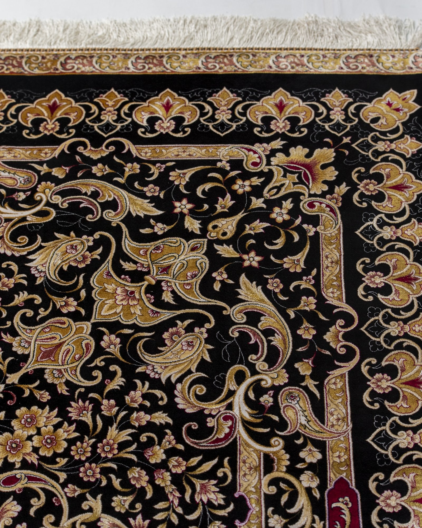 Isolde Persian silk rug folded corner showing fine weave, black and gold 200 x 300 cm - Tabeer Homes Dubai
